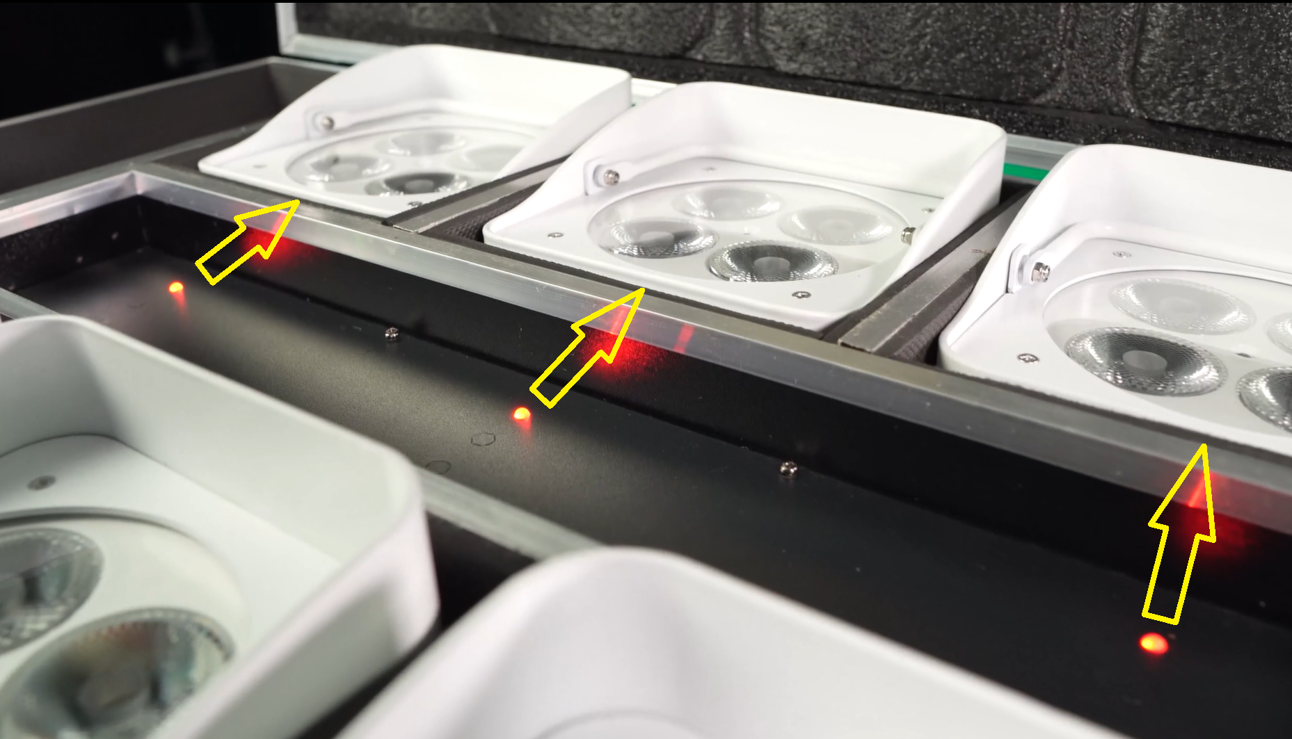 Lights in charging case with arrows point from red LEDs to nearest light