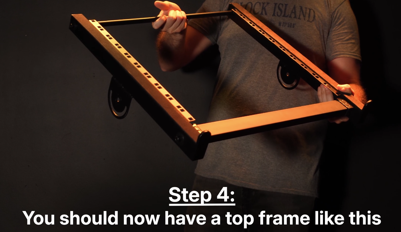 "Step 4: You should now have a top frame like this" -Top Rails on the sides with Connecting Beam and Stabilizing Rod attached across top and bottom.