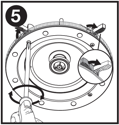 A technical line drawing labeled with the number 5 in a black circle at the top-left corner, illustrating the mechanism for securing the speaker:  Screwdriver Action: A hand holds a Phillips screwdriver engaging a screw on the front frame of the circular speaker. A circular arrow around the handle indicates turning the screwdriver clockwise.  Clamping Mechanism: Curved arrows near the rim show that tightening the front screws rotates the textured mounting clamps (dog legs) outward and down over the edge of the drywall ceiling.  Inset Detail View: A magnified circular callout highlights a mounting clamp extending outward from its stowed position to clamp down securely against the back side of the mounting surface.