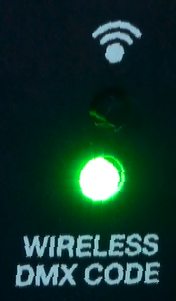 A vertical section of a black control panel labeled "WIRELESS DMX CODE" at the bottom, featuring a illuminated green indicator light and a Wi-Fi signal icon at the top.