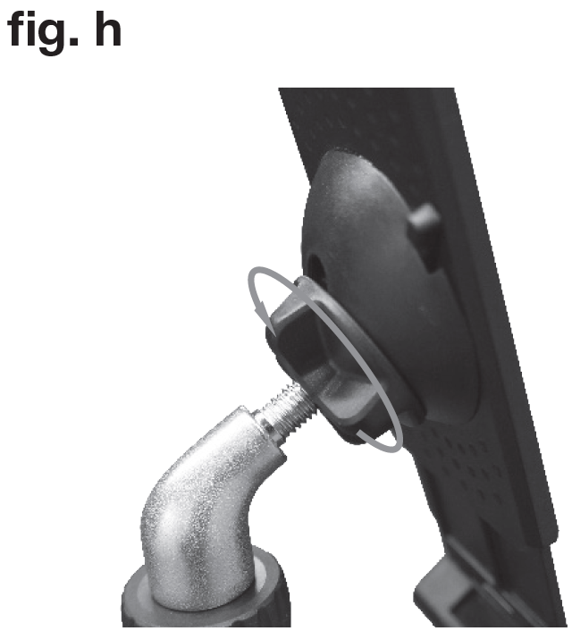 An instructional diagram labeled "fig. g" in the upper-left corner showing the tilt-adjustment mechanism on the back of a mounting plate:  Mounting Assembly: A black textured backing plate with a curved socket housing is attached to an angled metal neck joint using a threaded bolt and a large plastic wing knob.  Adjustment Mechanism: A plastic wing knob with two wide grips sits on the threaded rod between the metal elbow extension and the back of the device panel.  Directional Indicators:  A straight diagonal arrow points directly to the wing knob on the back of the mount assembly.  A circular grey arrow loops around the wing knob, illustrating the rotational direction needed to tighten the knob against the joint socket to lock the panel's viewing angle in place.