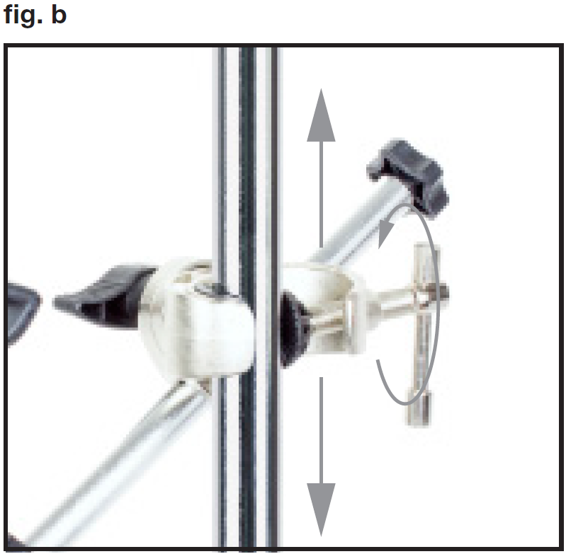 An instructional photo labeled "fig. b" in the top-left corner demonstrates attaching and adjusting the clamp on a vertical support shaft:  Vertical Mounting: The metallic C-clamp is fitted around a vertical stand pole or shaft.  Height Adjustment: Straight vertical arrows pointing up and down along the pole show that the assembly can slide up or down to set the desired height when loosened.  Tightening Mechanism: A circular grey arrow around the silver T-bar screw handle on the right indicates rotating the handle to secure the clamp firmly in place on the vertical pole.